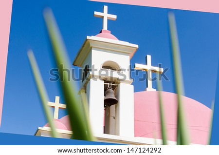 Pink domes and golden crosses on Greek Orthodox Church of the Seven Apostles in Capernaum