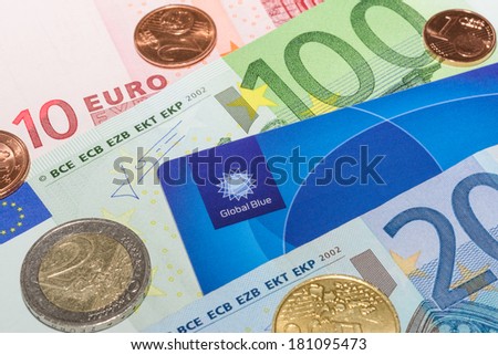 MUNICH, GERMANY - FEBRUARY 23, 2014: European currency notes and coins with Tax Free plastic card
