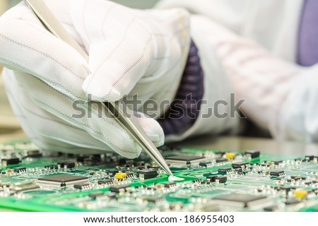 Engineering and electronic component quality control in QC lab on computer PCB turnkey manufacturing