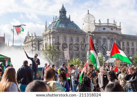 MUNICH, GERMANY - AUGUST 16, 2014: Peaceful demonstration for stopping Israel-Palestine conflict and ceasefire in Gaza Strip. Activist group calls negotiations between the warring parties.