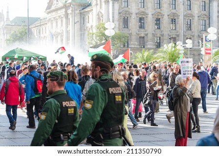MUNICH, GERMANY - AUGUST 16, 2014: German police to maintain order on the pro-Palestinian demonstration. European activists demand freedom and independence for the people of Gaza and to stop the war.