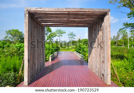 Luxury wood gate to the entrance in the garden