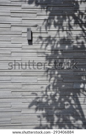 Tree shadows on the stone wall