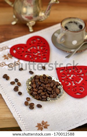 Cup of coffee , whole coffee beans, antique coffee pot  and decorative heart (Heart Shape)