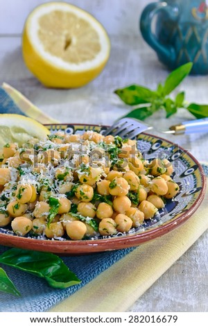 Chickpea salad with lemon, Parmesan cheese and fresh herbs. Selective focus