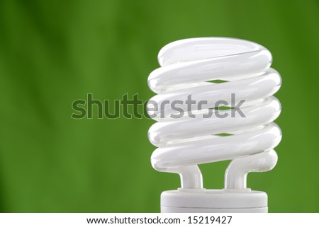 Compact fluorescent bulb with a green background.