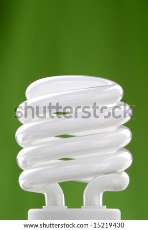 Compact fluorescent bulb with a green background.