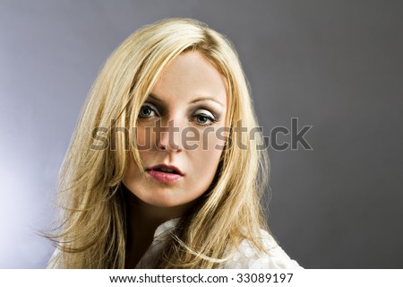 Great looking female model against plain background with copy space.