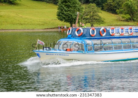 LAKE WINDERMERE, CUMBRIA, ENGLAND - OCT 18th 2014: People on a cruise ship ship Miss Cumbria at  Lake Windermere, Cumbria, England.