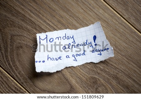 Monday Already Written On Piece Of Paper, On A Wood Background.