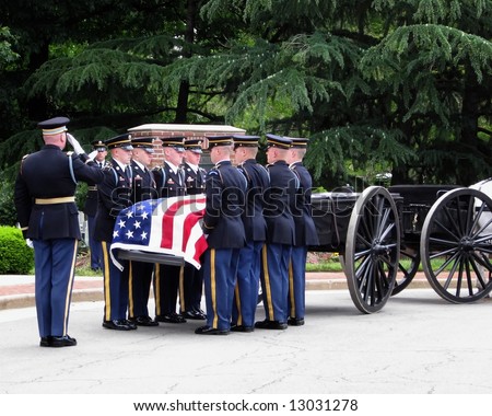 flag-covered casket on caisson at military funeral