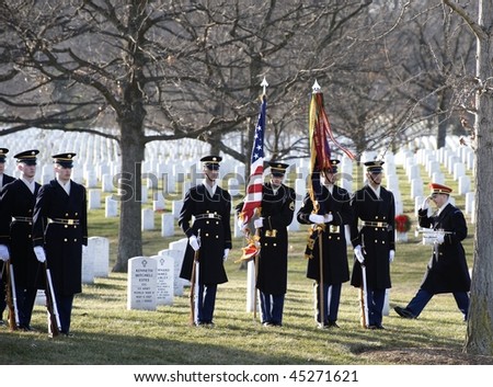 WASHINGTON - JANUARY 14: Color guard at attention for full honors funeral at Arlington Cemetery on January 14, 2010 in Arlington, VA.
