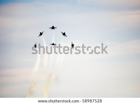 WASHINGTON DC, ANDREWS AFB - MAY 16: US Navy Demonstration Squadron Blue angels, flying on Boeing F/A-18 showing precision of flying in signature starburst maneuver on May 16, 2010 in Washington DC.