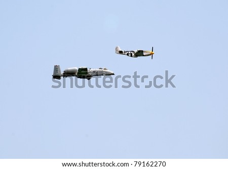 OCEAN CITY, MD - JUNE 11: Fairchild Republic A-10 fighter jet (Warthog) and P-51 Mustang  in heritage flight during the annual Ocean City Air Show on June 11, 2011 in Ocean City, Maryland.