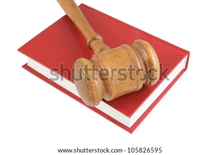 Judge\'s gavel on red legal book isolated