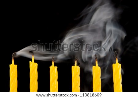 Yellow candles with smoke, the end of party