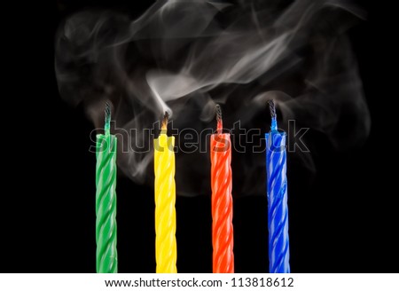 Four candles with smoke, the end of party