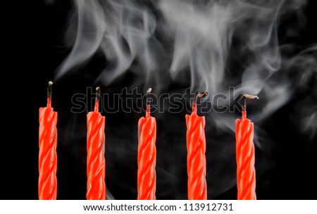 Five red candles with smoke, the end of party
