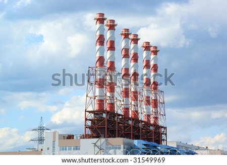 Factory and plant on blue sky background