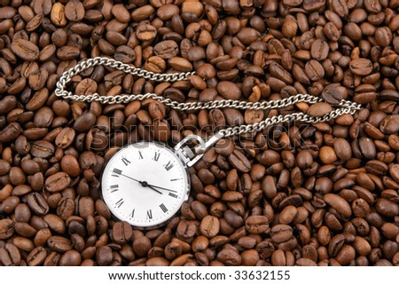 Coffee time, watch on grains background