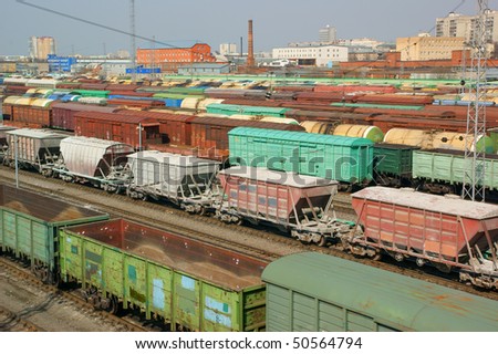 Many freight wagons on city cargo terminal
