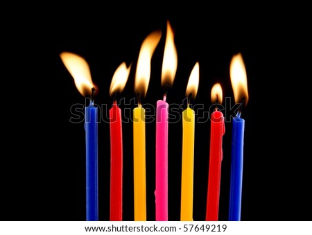 Some lit birthday candles close up