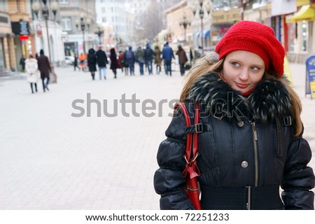 Woman in winter city street close up