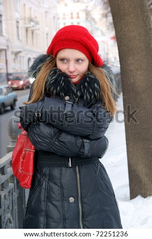 Woman in winter city street close up