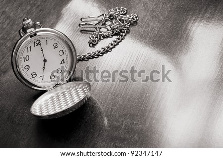 Old watch on wooden background