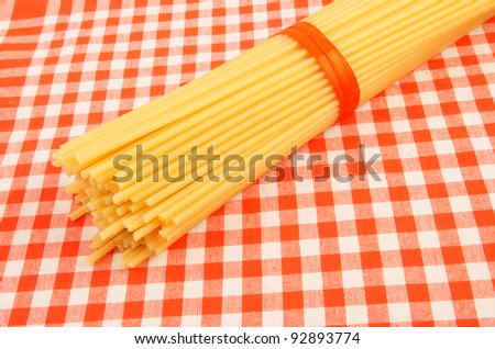 Macaroni on red checked tablecloth