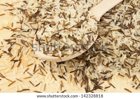 Rice cereal and wooden spoon on wooden table