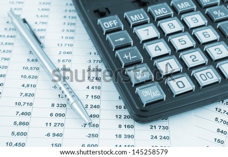 Business concept with pen, calculator and documents
