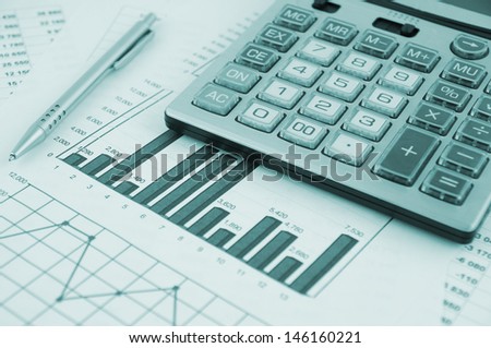 Business concept with pen, calculator and documents