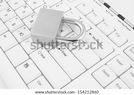 Security concept, padlock on white computer keyboard