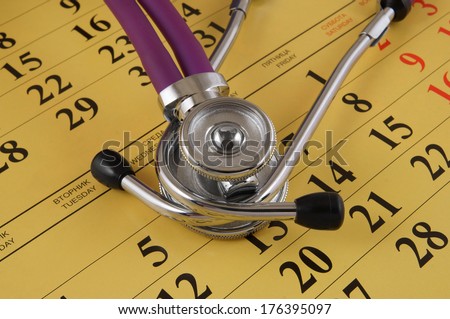 Regular medical examination concept, stethoscope on calendar