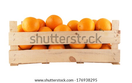Fresh and ripe orange fruits in wooden box isolated