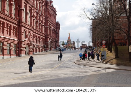 MOSCOW - MARCH 28: Tourists visiting the Red Square on March 28, 2014 in Moscow, Russia. The Red Square and the Kremlin are the main attractions in Moscow.