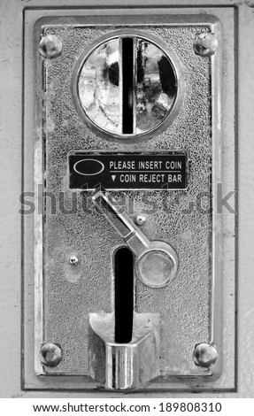 Old metal coin slot panel from a coin operated machine