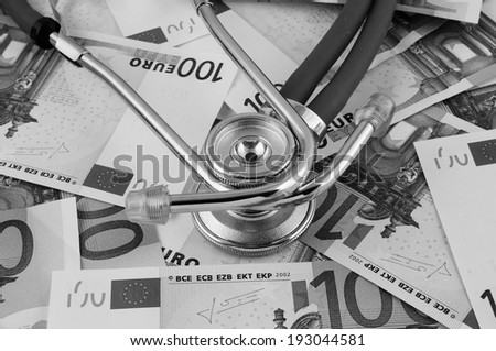 Stethoscope on euro banknotes, cost of healthcare concept