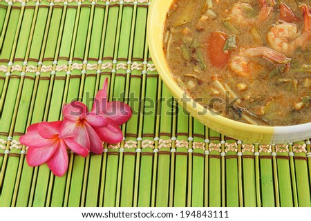Thailand food tom yum kung in bowl on bamboo background