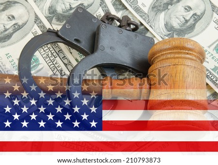 Gavel and handcuffs on money background, usa legal system concept