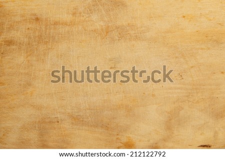 Old grunge wooden kitchen cutting board as background