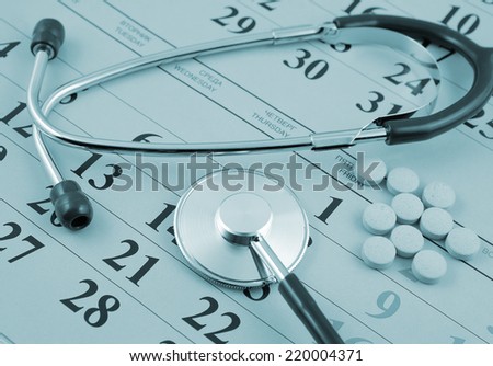 Regular medical examination concept, stethoscope and drugs on calendar