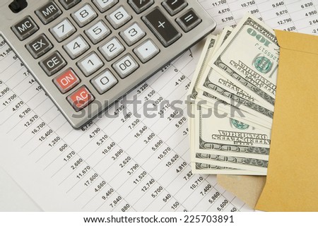 Business and profits concept with calculator, money in envelope and documents