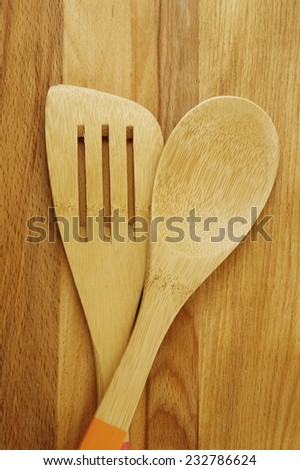 Wooden spoon and spatula on table