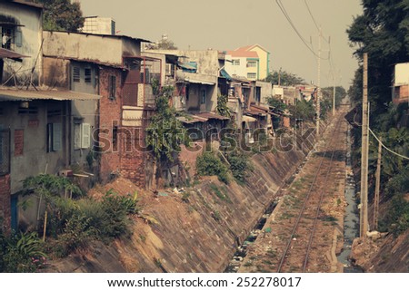Railroad tracks in Vietnam near poor houses