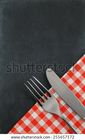 Chalk board background with fork and knife, menu concept