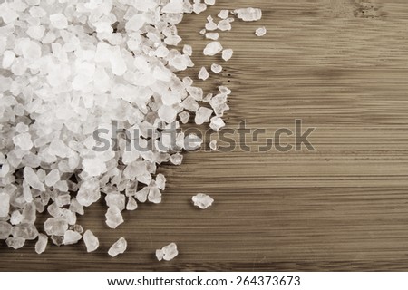 Sea salt on wooden background