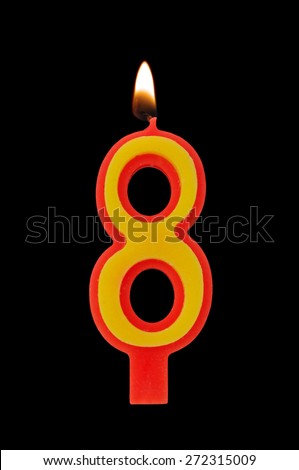 Birthday candle isolated on black background, number  8