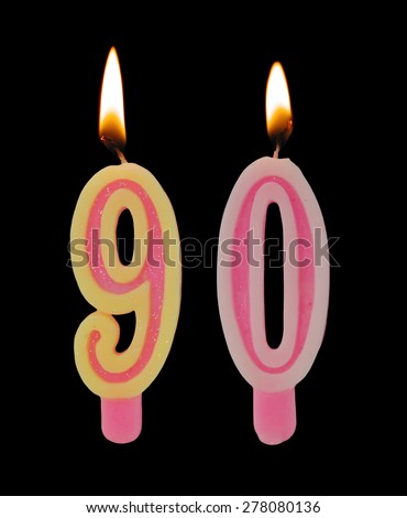 Burning birthday candles on black background, number 90